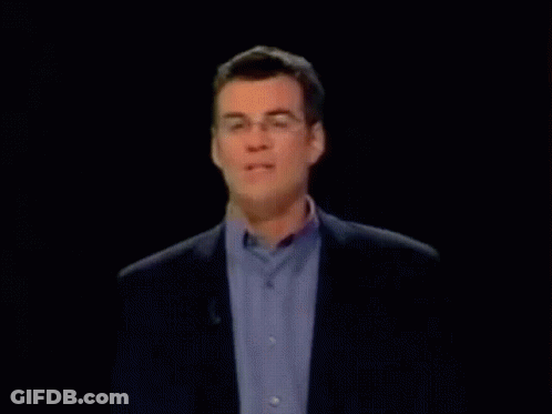 Man With Glasses And Blue Shirt On Microphone GIF