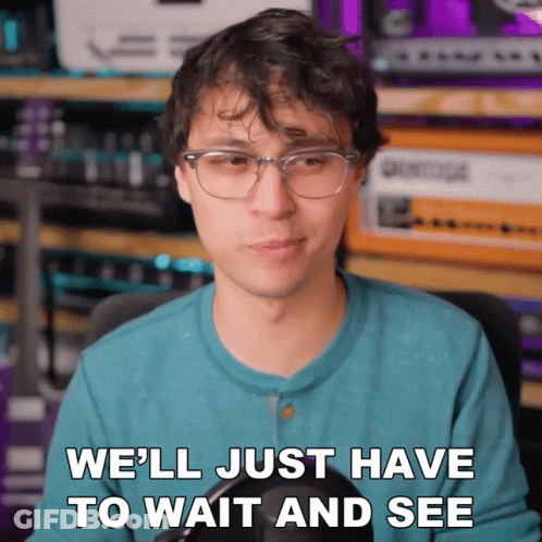 Man With Glasses And Blue Shirt Says We'll Just Have To Wait And See GIF