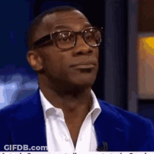 Man With Glasses And Blue Suit Looking GIF