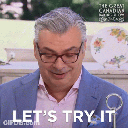 Man With Glasses And Blue Suit Saying Let's Try It GIF
