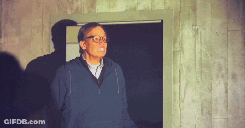Man With Glasses And Blue Sweatshirt In Doorway GIF