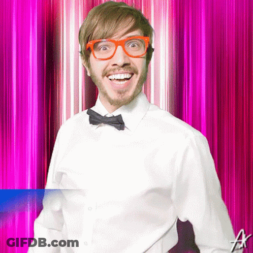 Man With Glasses And Bow Tie Smiling On Pink Background GIF