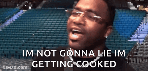 Man With Glasses And Chain Screaming In Empty Stadium GIF