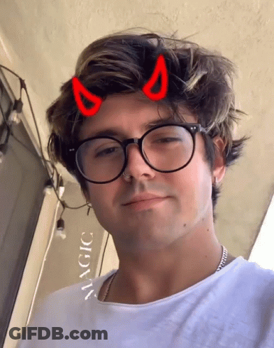 Man With Glasses And Devil Horns Saying Magic GIF