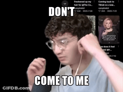 Man With Glasses And Ear Buds Says Come To Me GIF