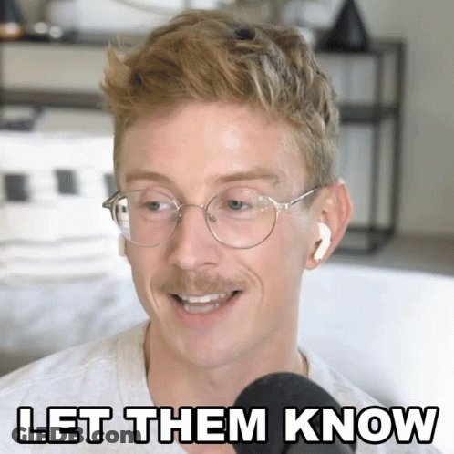 Man With Glasses And Earbuds Speaking GIF