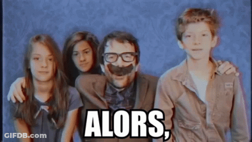 Man With Glasses And Fake Mustache Surrounded By Children Saying Alors GIF