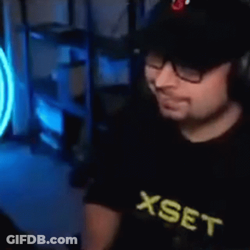 Man With Glasses And Hat At Computer GIF