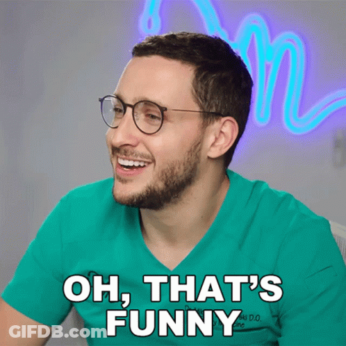 Man With Glasses And Hat At Computer In Restaurant GIF