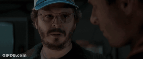 Man With Glasses And Hat Holding Cup Saying Monster GIF