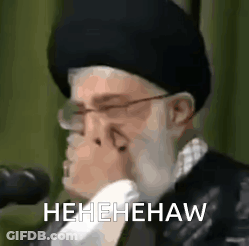 Man With Glasses And Hat Holding Nose Laughing GIF