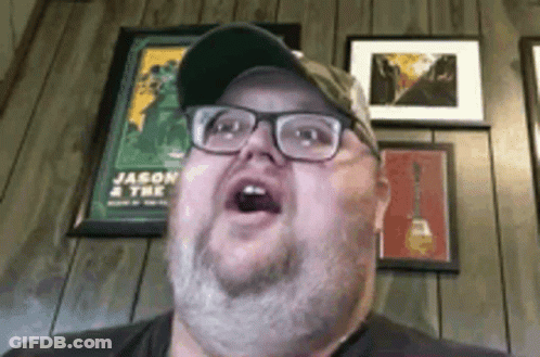 Man With Glasses And Hat Making Funny Face GIF