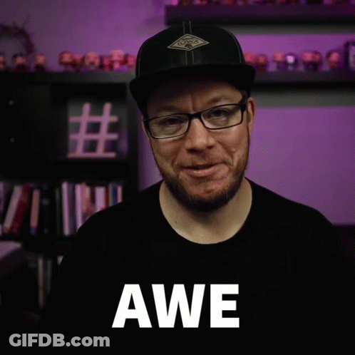 Man With Glasses And Hat Saying Awe GIF