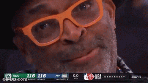 Man With Glasses And Hat Smiling At Basketball Game GIF
