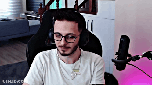 Man With Glasses And Headphones At Microphone GIF