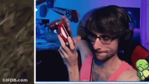 Man With Glasses And Headphones Holding Red Controller GIF