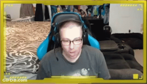 Man With Glasses And Headphones In Blue Gaming Chair GIF