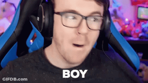 Man With Glasses And Headphones In Gaming Chair Making Funny Face GIF