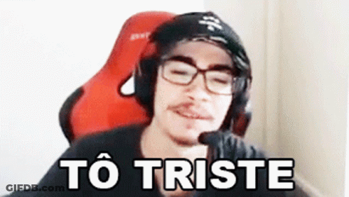 Man With Glasses And Headphones In Red Chair To Triste GIF