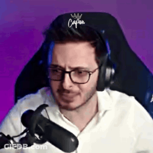 Man With Glasses And Headphones Making Funny Face At Microphone GIF