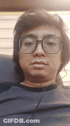 Man With Glasses And Headphones Sitting GIF