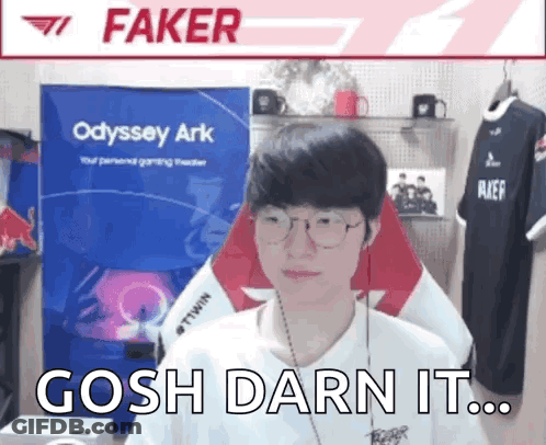 Man With Glasses And Headphones Sitting Near Faker Sign GIF