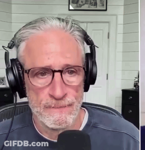 Man With Glasses And Headphones Talks Into Microphone GIF