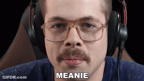 Man With Glasses And Moustache Says Meanie GIF