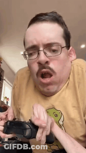 Man With Glasses And Mustache Holding Controller Funny Face GIF