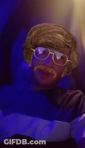 Man With Glasses And Mustache In Blue Shirt Saying Ice GIF