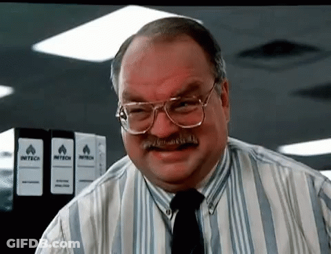 Man With Glasses And Mustache In Front Of Intech Binders GIF