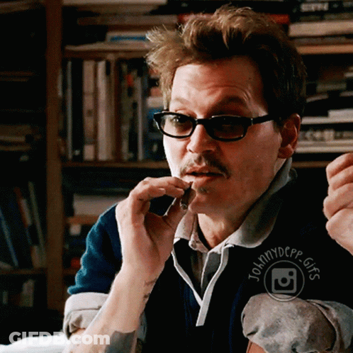 Man With Glasses And Mustache Wearing Johnny Depp Logo GIF