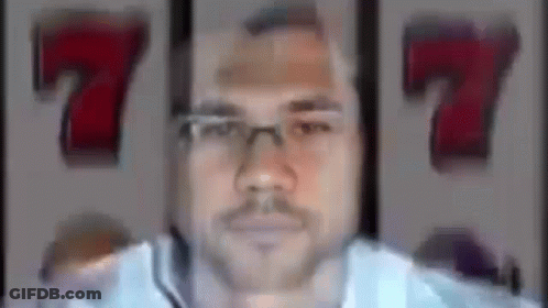 Man With Glasses And Mustache Winning Slot Machine Jackpot GIF