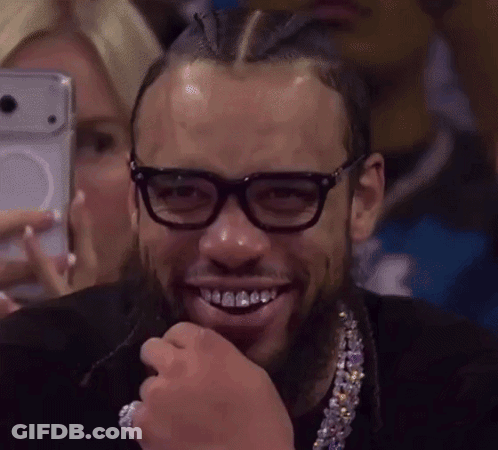 Man With Glasses And Necklace Smiling Selfie GIF