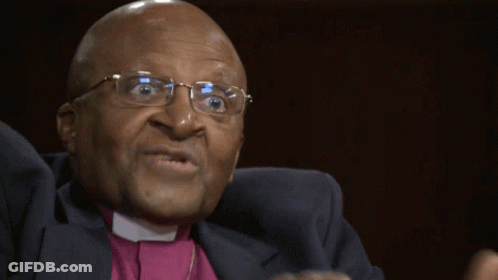Man With Glasses And Purple Shirt Making Funny Face GIF
