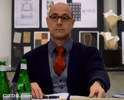 Man With Glasses And Red Tie Sitting At Table GIF