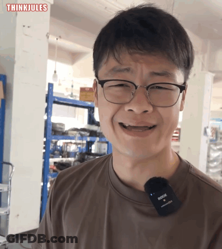 Man With Glasses And Rode Microphone GIF