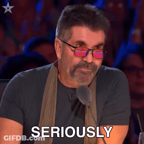 Man With Glasses And Scarf Speaking Seriously GIF