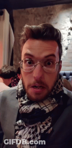 Man With Glasses And Scarf Surprised GIF