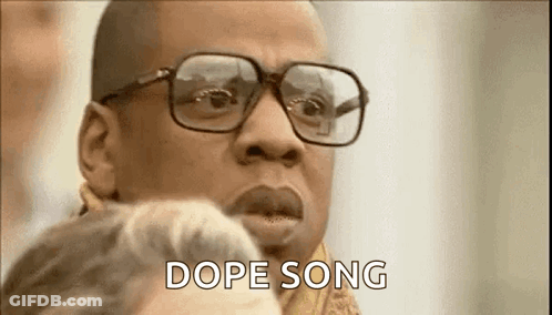 Man With Glasses And Scarf Talking To Woman GIF