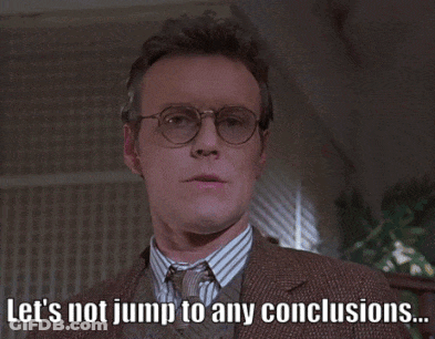 Man With Glasses And Suit Says Let's Not Jump To Any Conclusions GIF