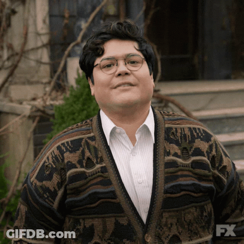 Man With Glasses And Sweater Saying FX GIF