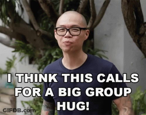 Man With Glasses And Tattoo Saying I Think This Calls For A Big Group Hug GIF