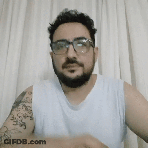 Man With Glasses And Tattoo Smiling GIF