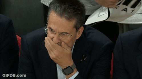 Man With Glasses And Watch Covering Mouth GIF