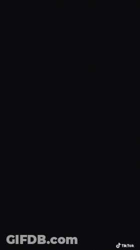 Man With Glasses And Watch Looking At Cell Phone GIF