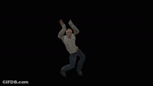 Man With Glasses And White Shirt Dancing In Dark GIF