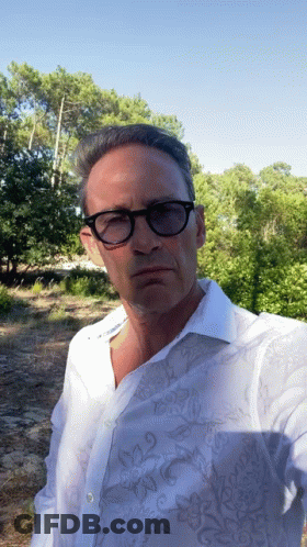 Man With Glasses And White Shirt Taking Selfie GIF