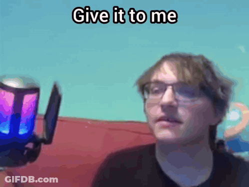 Man With Glasses At Microphone Saying Give It To Me GIF