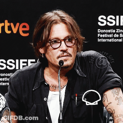 Man With Glasses At Microphone With Ssiff Sign GIF